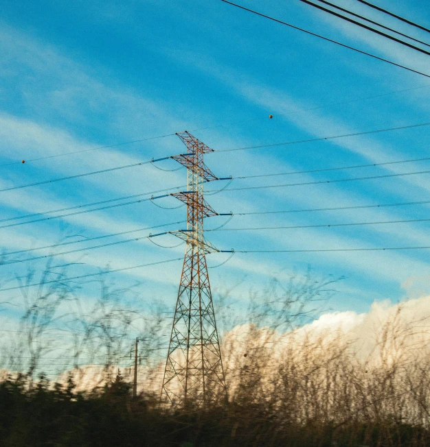 a view of power lines from a moving car, inspired by Elsa Bleda, unsplash, fan favorite, blue sky, color ( sony a 7 r iv, winter sun