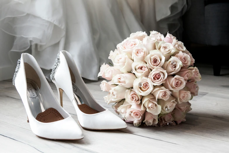 a bridal bouquet and wedding shoes on a wooden floor, pexels contest winner, white and silver, pink, thumbnail, roses