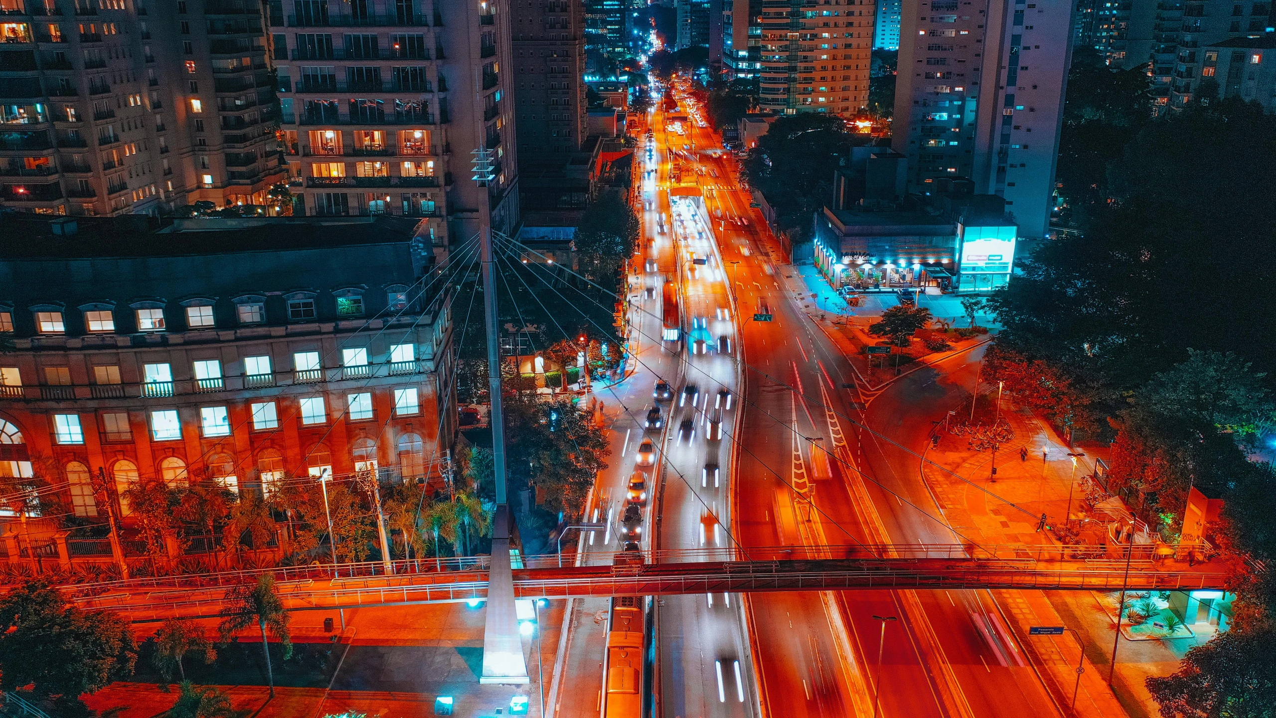 an aerial view of a city at night, by Luis Miranda, pexels contest winner, visual art, avenida paulista, orange and cyan lighting, snapchat photo, philippines