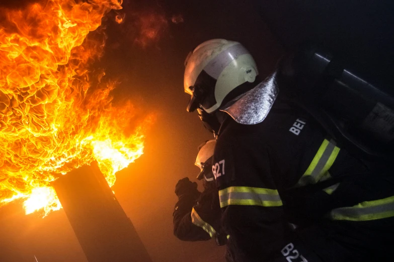 a firefighter standing in front of a fire, a photo, by Daniel Lieske, pexels contest winner, renaissance, gopro footage, avatar image, 2717433015, reportage photo