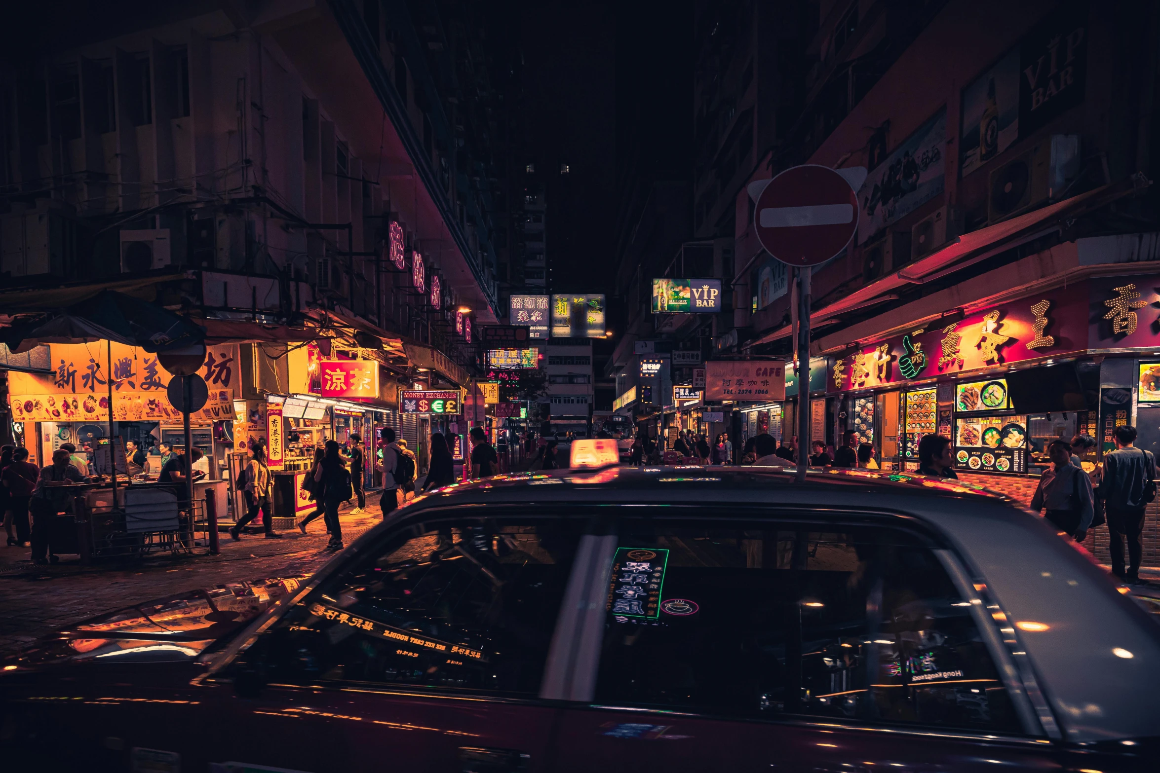 a car driving down a city street at night, inspired by Liam Wong, pexels contest winner, hyperrealism, kowloon walled city, people at night, purple lighted street, chinatown bar