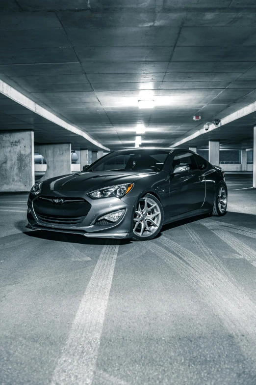 a black car parked in a parking garage, inspired by An Gyeon, solid gray, ds, infinity, highly upvoted