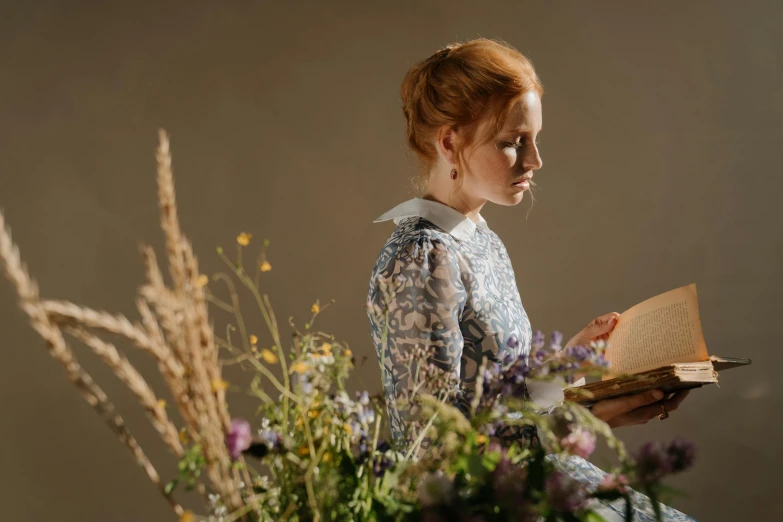 a woman reading a book in front of a bouquet of flowers, a portrait, inspired by Eleanor Vere Boyle, trending on unsplash, pre-raphaelitism, sadie sink, side profile waist up portrait, light behind, holding grimoire