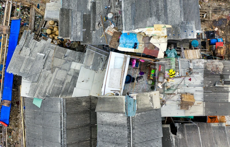 a bird's eye view of a group of shacks, pexels contest winner, conceptual art, collapsed building, kowloon, “hyper realistic, 2 0 2 2 photo