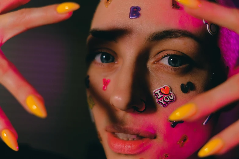 a close up of a person with colorful nails, an album cover, by Julia Pishtar, antipodeans, face paint, low quality photo, emoji, anton fadeev 8 k