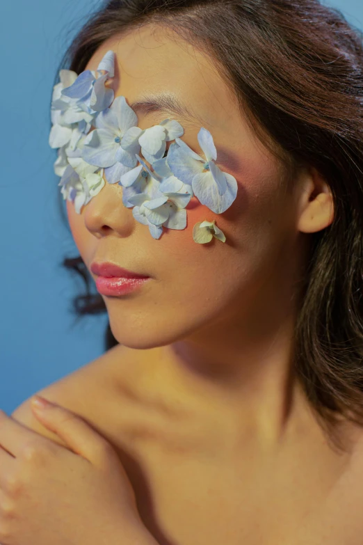 a woman with flowers painted on her face, an album cover, by Natasha Tan, sleek oled blue visor for eyes, louise zhang, low angle shot, fragments