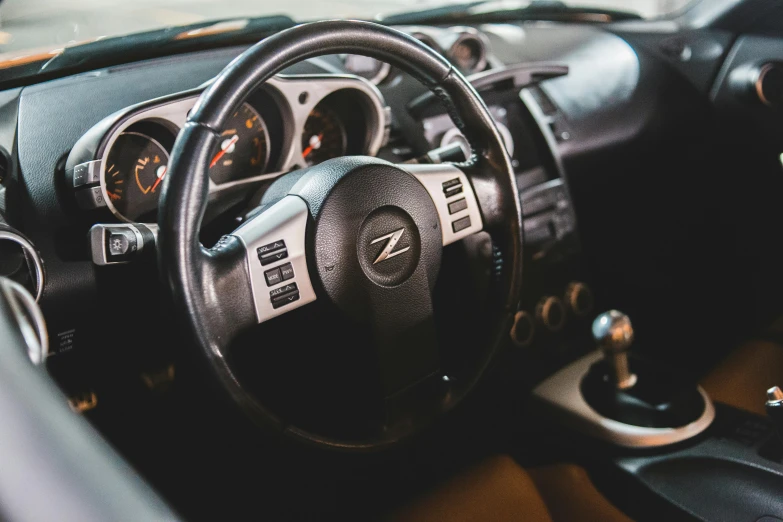 a close up of a steering wheel in a car, a portrait, by Kristian Zahrtmann, unsplash, sports car in the room, 2 5 6 x 2 5 6 pixels, interior of a small, japanese