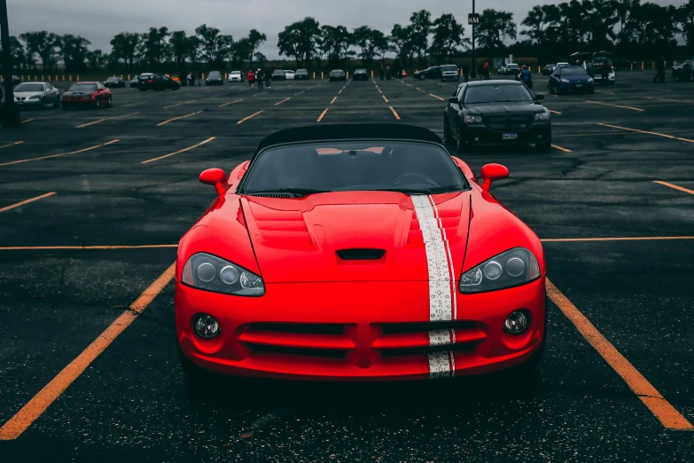 a red sports car parked in a parking lot, pexels contest winner, soft color dodge, 15081959 21121991 01012000 4k, orange racing stripes, seductive stare