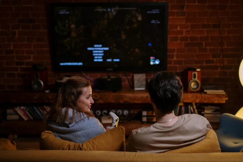 two people sitting on a couch watching tv, pexels, renaissance, pc game with ui, uk, indoor shot, high quality picture