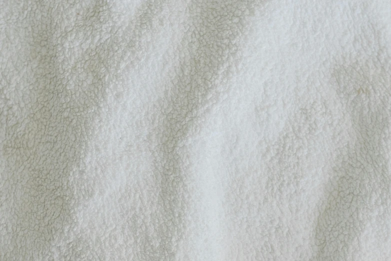 a close up of a white towel on a bed, pbr texture, snow camouflage, extremely grainy, powder