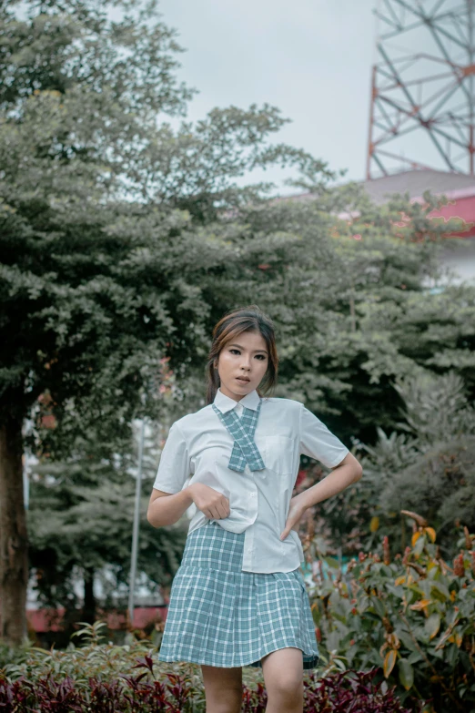 a girl in a school uniform posing for a picture, a colorized photo, by Cherryl Fountain, unsplash, realism, woman model, cindy avelino, 😭 🤮 💕 🎀, medium long shot