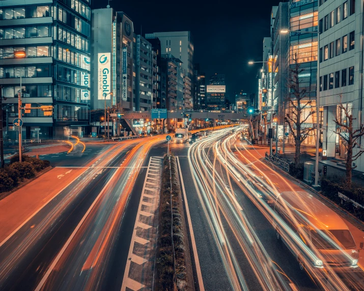 a city street filled with lots of traffic at night, pexels contest winner, visual art, japan. volumetric lighting, thumbnail, time - lapse, instagram photo