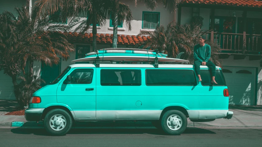 a man sitting on top of a surfboard on top of a van, pexels contest winner, renaissance, turquoise color scheme, full car, ((greenish blue tones)), soft color dodge