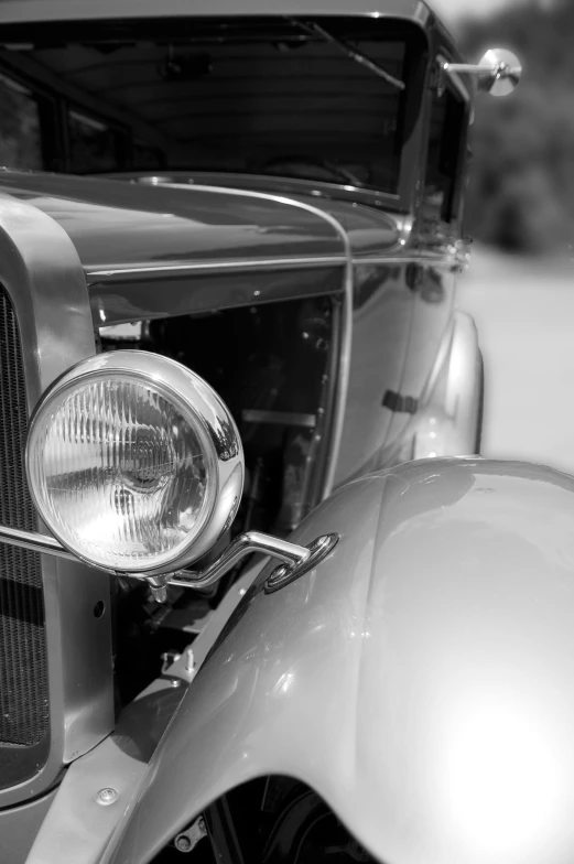 a black and white photo of a classic car, a black and white photo, by Dave Melvin, square, closeup, fine art photograph, early 20s