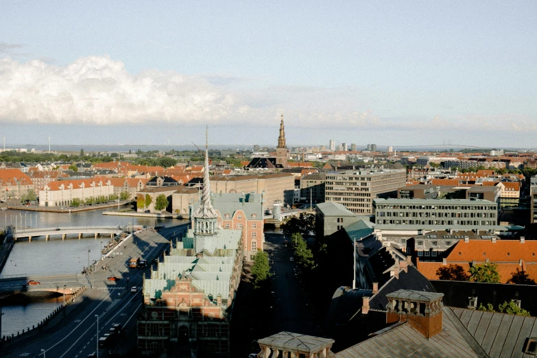 a view of a city from the top of a building, by Christen Dalsgaard, hurufiyya, slide show, brown, spire, high-resolution