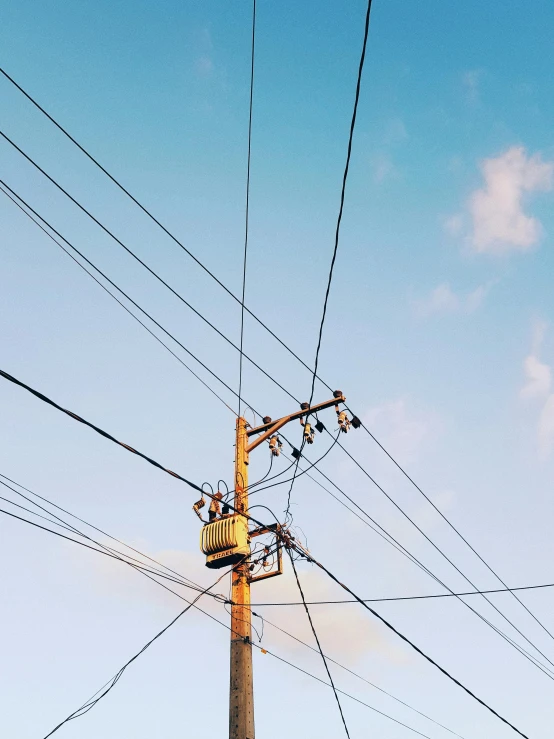 a telephone pole and power lines against a blue sky, trending on pexels, profile image, ilustration, electrical wiring!, single image