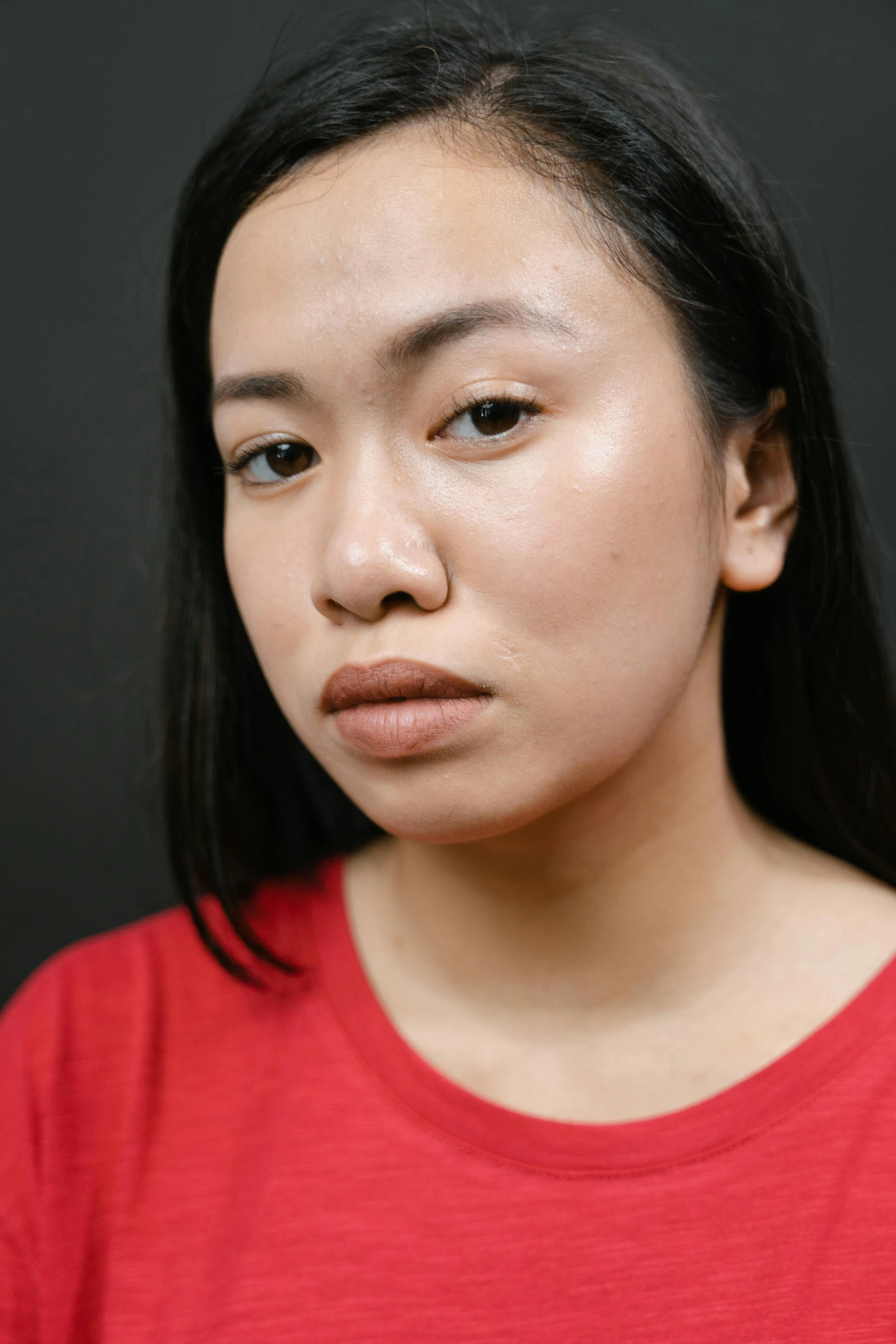 a close up of a person wearing a red shirt, inspired by Natasha Tan, pouty face, south east asian with round face, taken in 2 0 2 0, her skin is light brown