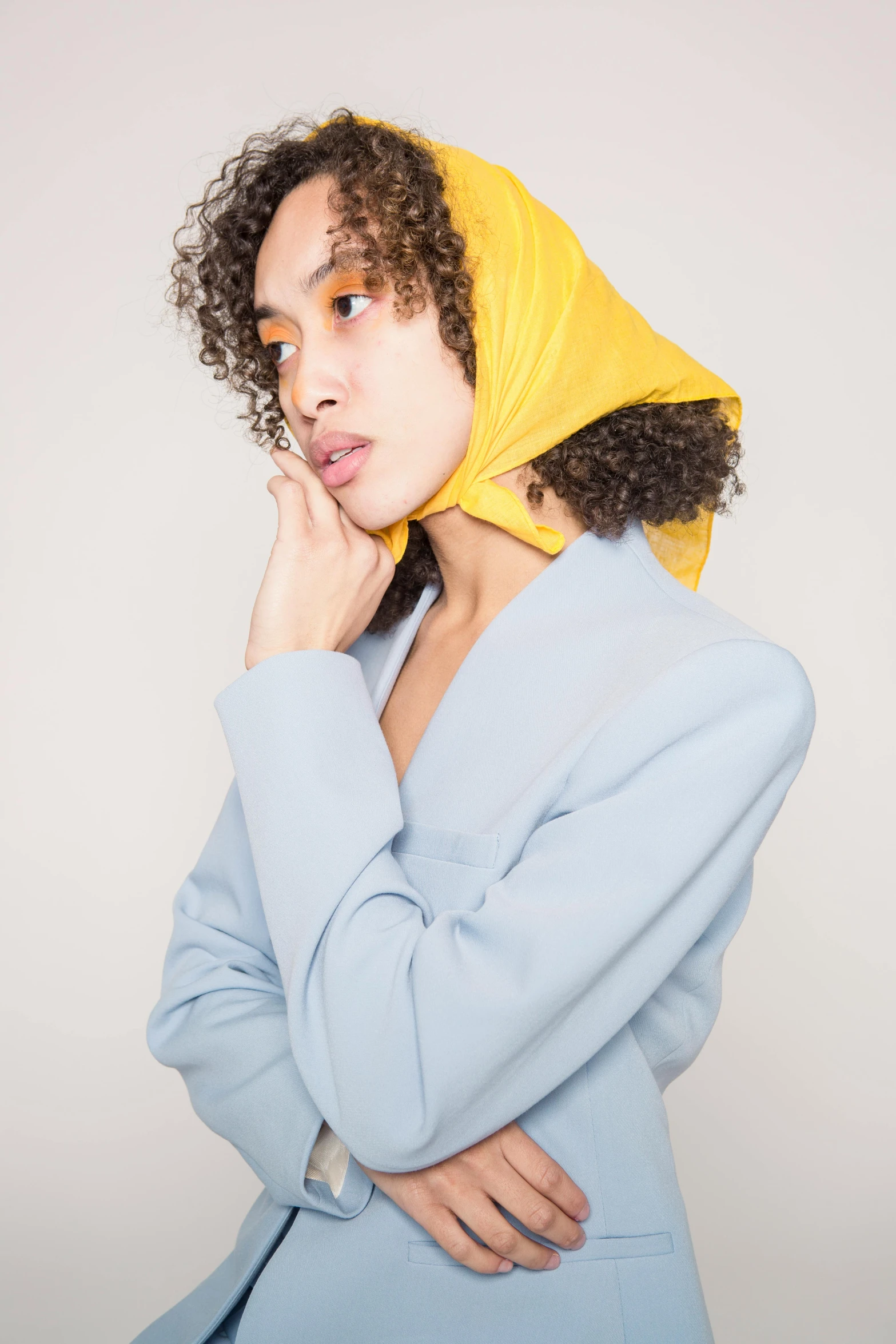 a woman with a yellow scarf on her head, an album cover, inspired by Jean-Étienne Liotard, trending on unsplash, blue hoodie, imaan hammam, 2019 trending photo, slide show