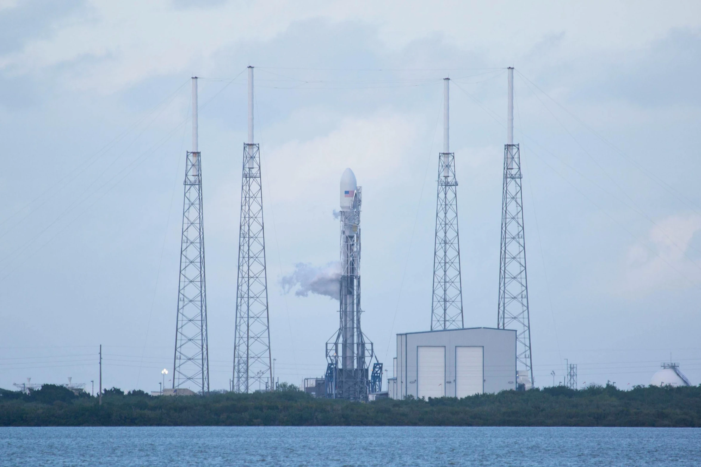 a rocket that is sitting on top of a body of water, renaissance, seen from a distance, spacex, maintenance photo, thumbnail