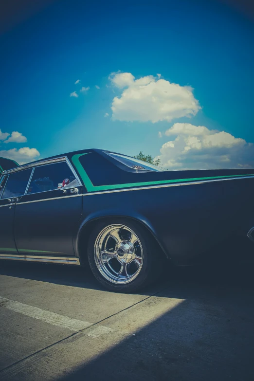 a black car parked on the side of the road, by Matt Cavotta, pexels contest winner, renaissance, black and cyan color scheme, lowriders, 15081959 21121991 01012000 4k, on a racetrack