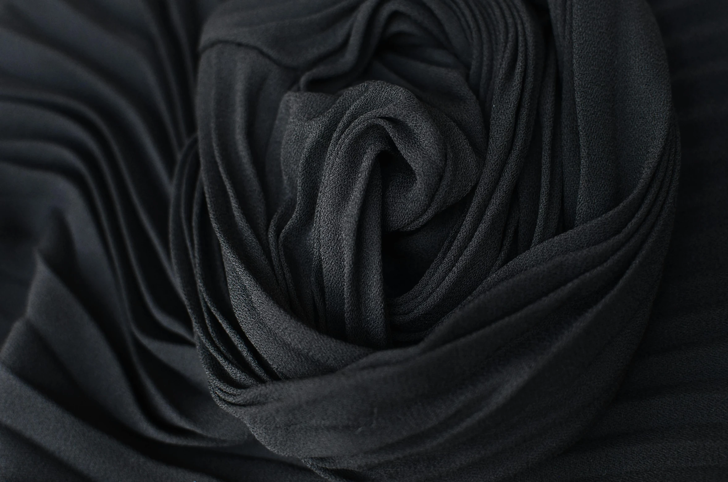 a close up shot of a black fabric, inspired by Edward Weston, unsplash, in a black chiffon layered robe, folds, 3 d close - up, main colour - black