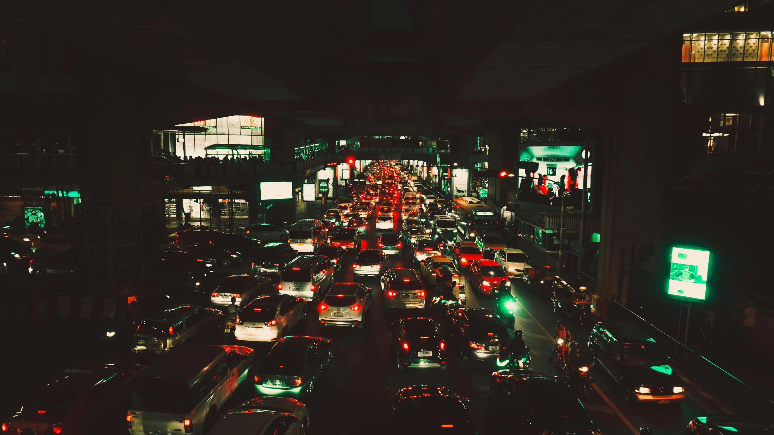 a city street filled with lots of traffic at night, an album cover, by Alejandro Obregón, pexels contest winner, green light, terminal, overcrowded, promo image