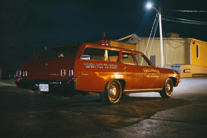 a red station wagon parked in a parking lot at night, an album cover, by Winona Nelson, pexels contest winner, lowriders, documentary still, willim blake, todd solondz