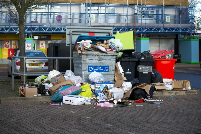 a pile of garbage sitting on the side of a road, by Rachel Reckitt, shutterstock, taken from the high street, square, thumbnail, market