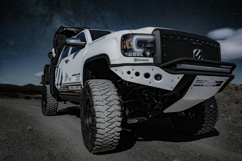 a white truck sitting on top of a dirt road, custom headlights, fully armored, profile image, thrusters