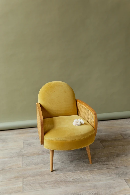 a yellow chair sitting on top of a wooden floor, inspired by Aimé Barraud, baroque, caramel, 5 0 s, olive, monaco