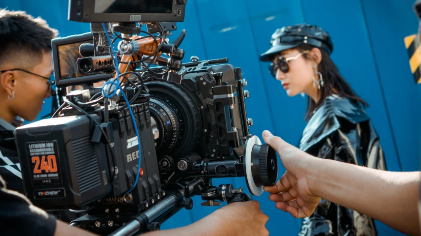 a group of people standing around a camera, arri alexa, cinematic goddess close shot, action movie still, cinematic outfit photo