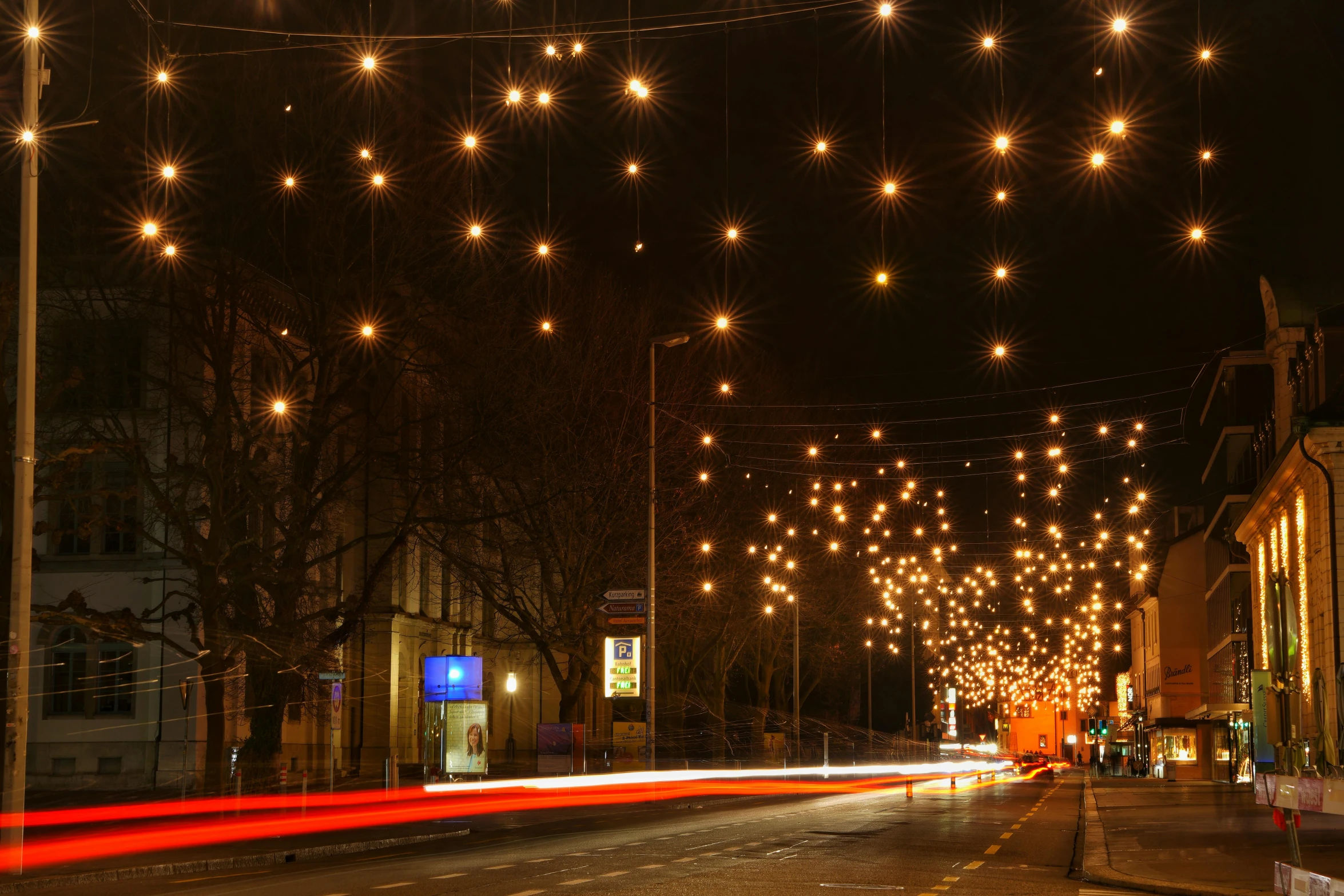 a city street filled with lots of lights, award winning lighting, north melbourne street, twinkling stars, lighting on concrete