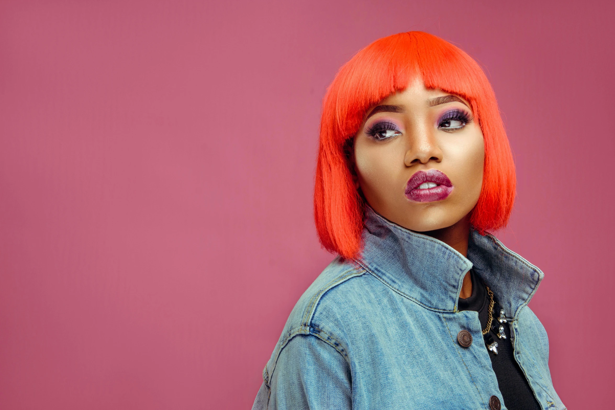 a woman with bright red hair wearing a denim jacket, trending on pexels, pop art, portrait of ororo munroe, peach and goma style, promotional photo, coloured photo