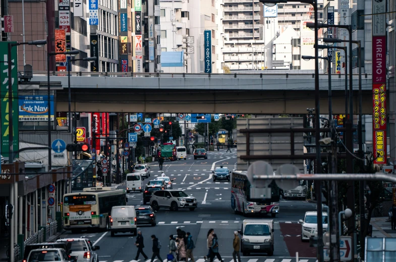 a city street filled with lots of traffic and tall buildings, unsplash, sōsaku hanga, square, thumbnail, full frame image, ethnicity : japanese