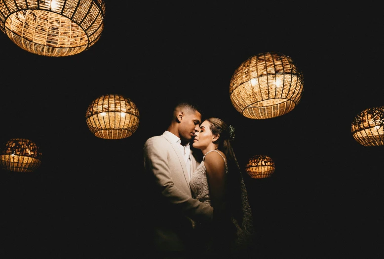 a bride and groom kissing in front of lanterns, pexels contest winner, renaissance, lowkey lighting, pablo olivera, profile image, shot from below