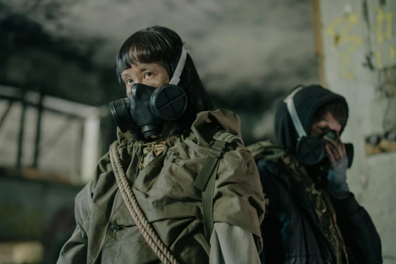 a man and a woman wearing gas masks, pexels contest winner, iu lee ji-eun as a super villain, military clothing, worksafe. cinematic, wearing dirty travelling clothes