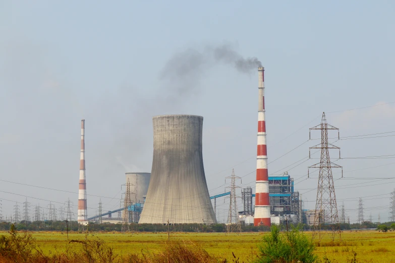 a factory with a lot of smoke coming out of it, pexels contest winner, nuclear art, floating power cables, thumbnail, 2263539546], chimney