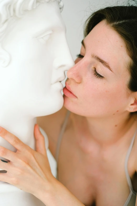 a close up of a person kissing a statue, a marble sculpture, smooth porcelain skin, vocal tract model, emily rajtkowski, barbara canepa