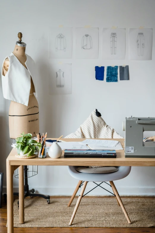 a sewing machine sitting on top of a wooden table, trending on unsplash, process art, 9 9 designs, office furniture, mannequin, society 6