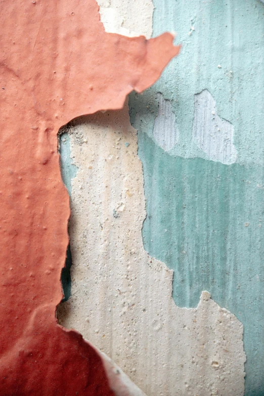 a close up of peeling paint on a wall, an album cover, inspired by Lucio Fontana, trending on unsplash, earth and pastel colors, viridian and venetian red, concrete ), video still