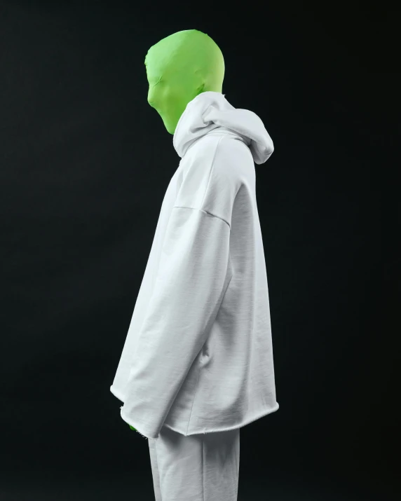 a person wearing a white hoodie and a green mask, inspired by Gao Cen, unsplash, neo-dada, full body profile pose, showstudio, detailed product image, high resolution photo