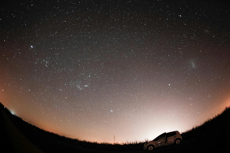 a truck parked on the side of a road under a sky full of stars, a picture, getty images, 2 5 6 x 2 5 6 pixels, looking onto the horizon, andromeda