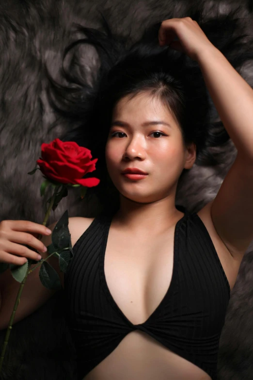 a woman in a black bikini holding a red rose, a picture, inspired by Ruth Jên, pexels contest winner, young cute wan asian face, smol, grey, south east asian with long