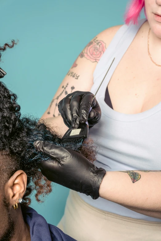 a man getting his hair cut by a woman, a tattoo, by Meredith Dillman, trending on pexels, process art, dripping black iridescent liquid, a black man with long curly hair, two tone hair dye, closeup portrait