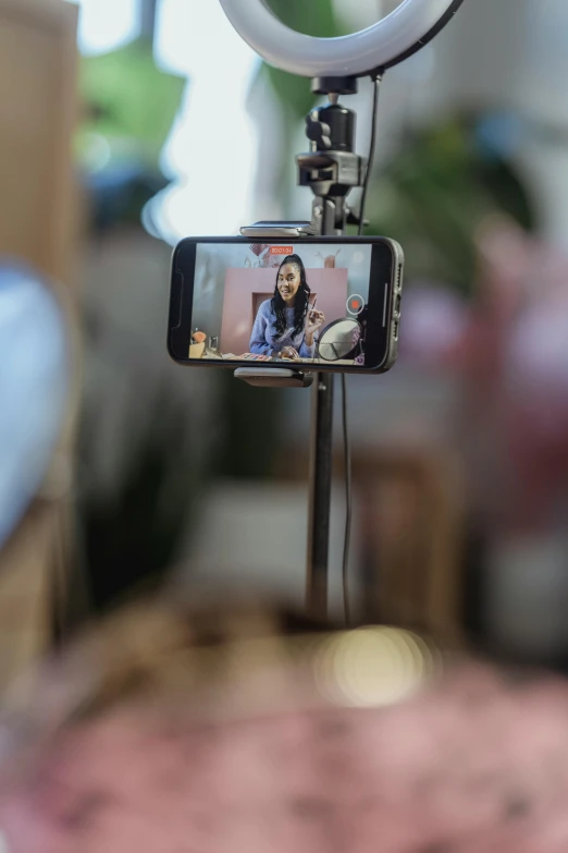 a close up of a cell phone on a tripod, a portrait, video art, twitch streamer, with a long, diy