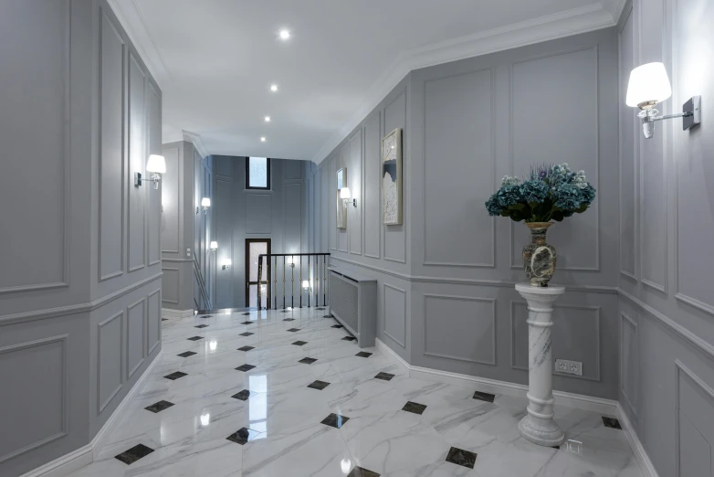a hallway with a vase of flowers on a pedestal, a 3D render, inspired by Sydney Prior Hall, neoclassicism, luxury bespoke kitchen design, white and grey, youtube thumbnail, commercial lighting