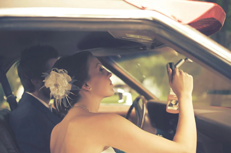 a bride sitting in the driver's seat of a car, pexels, happening, looking at his phone, square, alana fletcher, retro stylised