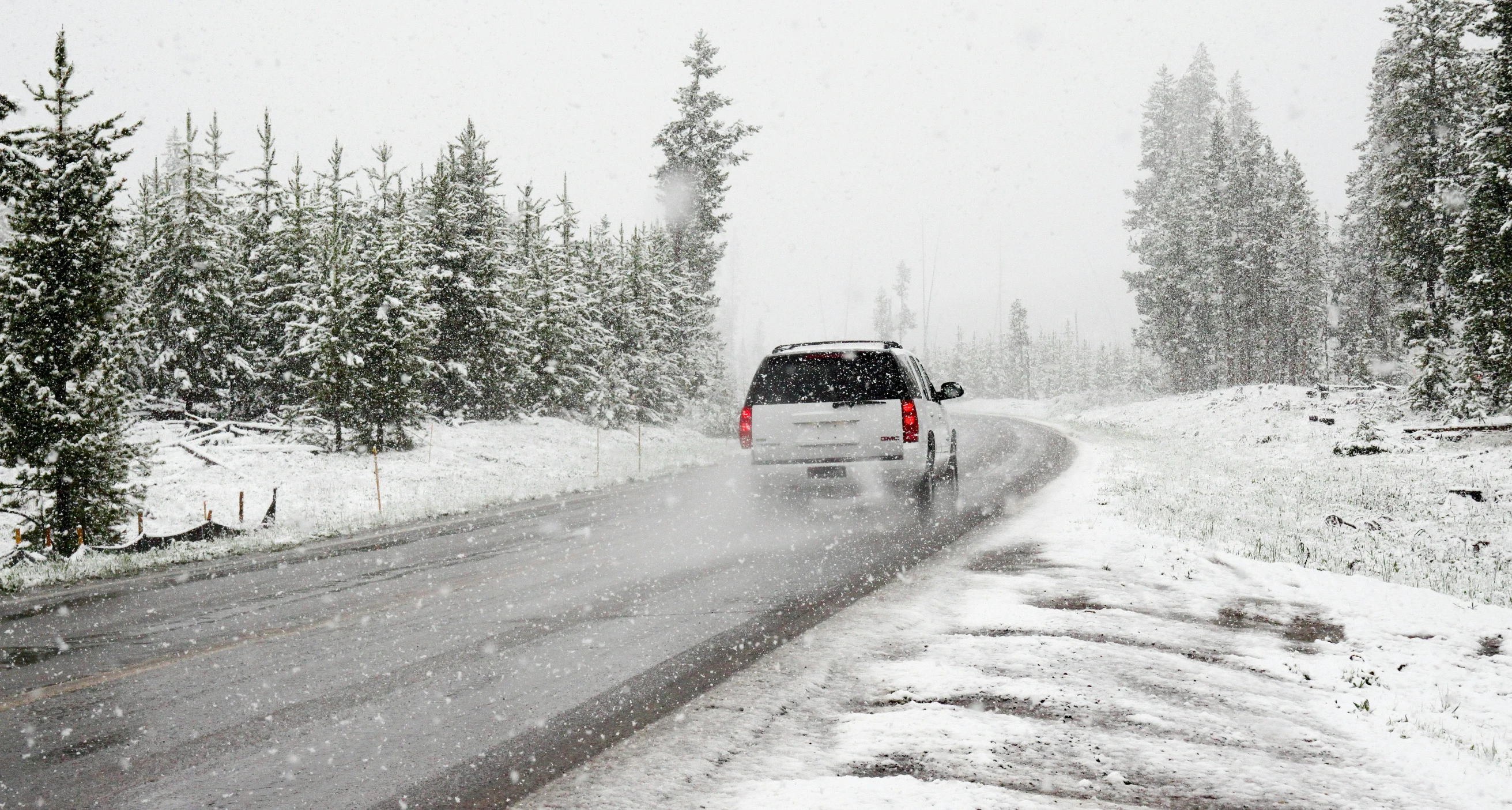 a white van driving down a snow covered road, low pressure system, promo image, background image, instagram picture