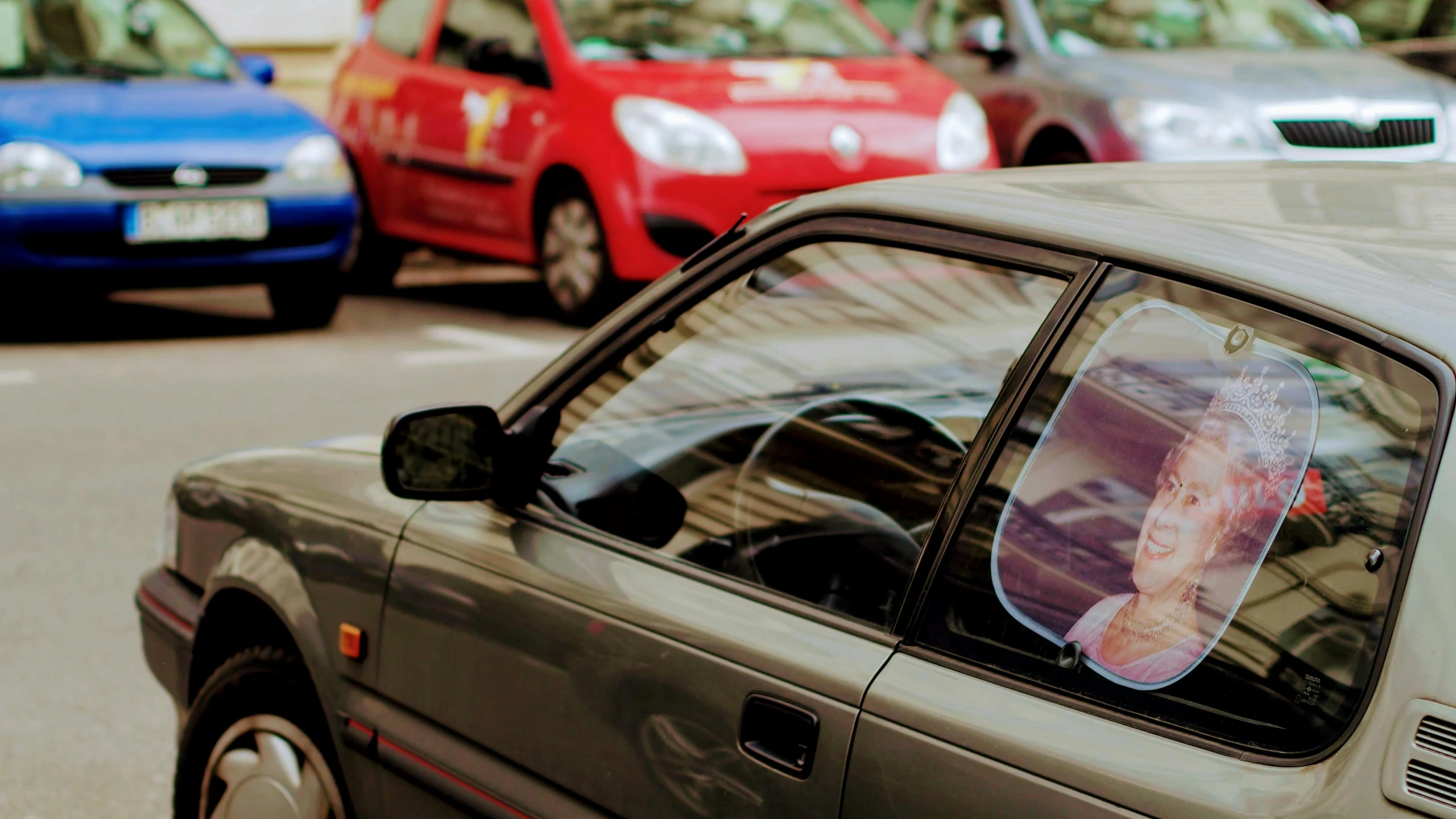 a car is parked on the side of the street, pexels contest winner, photorealism, viewed through the cars window, square, avatar image, customers