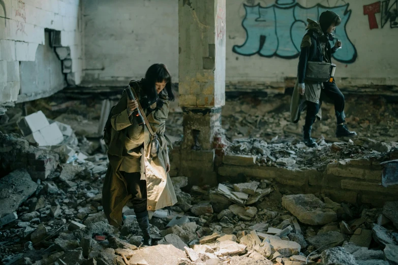 a man in a trench coat standing in a destroyed building, by Adam Marczyński, pexels contest winner, visual art, two characters, carrying mosin on back, z nation, brutalist fashion show